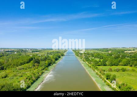 This landscape photo was taken in Europe, France, Normandy, towards Caen, Ranville, in summer. We see Le Pont de Ranville on the Orne canal in the mid Stock Photo