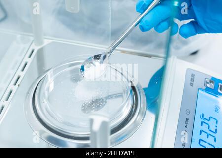 Scientist using an analytical balance at laboratory Stock Photo - Alamy