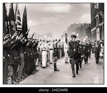 OSWALD MOSLEY BUF PARTY 1930s Great Britain Oswald Mosley, leader of  'British Union of Fascists' taking a far right Nazi type salute from supporters during a facist rally in London 1937 Head of British Union of Fascists Stock Photo