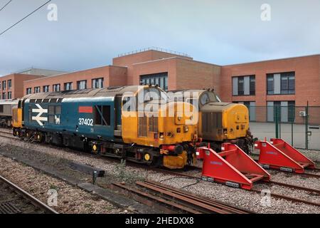 Direct Rail Services Class 37 diesel-electric locomotives 37402 and 37424 stabled at York, UK on 30/12/2021. Stock Photo