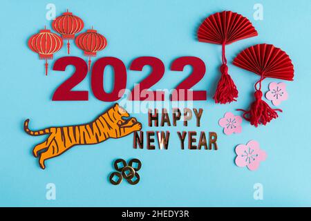 Chinese New Year, year of the tiger. Paper decoration with traditional motifs and tiger on blue background. Copy space. Stock Photo