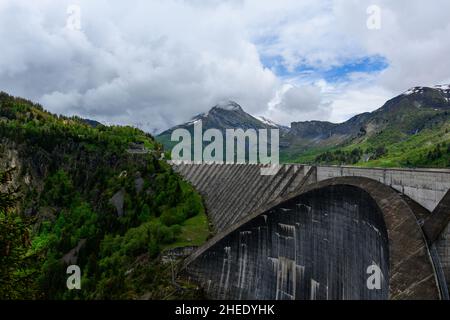 This landscape photo was taken in Europe, in France, in the Alps, towards Beaufort, in the Alps, in summer. We can see Le Barage de Roselend, under th Stock Photo