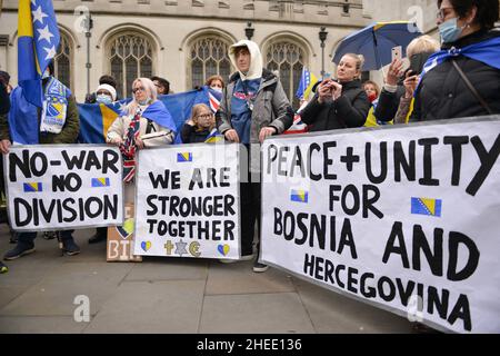 Protesters hold banners during the demonstration. Bosnia and Herzegovina diaspora, and supporters of the country's unity, gathered at Parliament Square in London to raise awareness of a potential new Bosnian crisis. After Bosnian Serbs blocked the work of the central government, fears have been resparked of a country-wide breakup in their biggest crisis since the 1990s war. Stock Photo