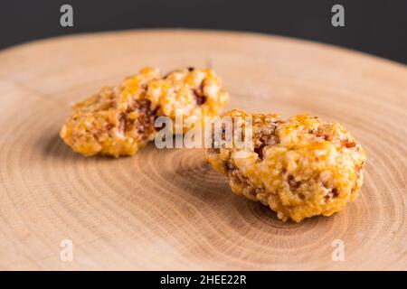 Two roasted almonds on wood Stock Photo