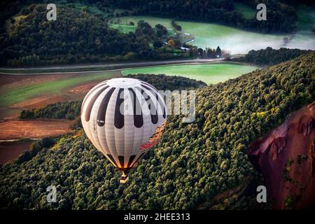 On balloon over Croscat volcano in Garrotxa Natural Park and mountains on the background in Garrotxa Olot Girona province Catalonia, Spain.  Vol de Co Stock Photo