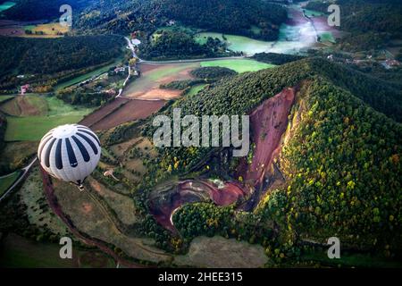 On balloon over Croscat volcano in Garrotxa Natural Park and mountains on the background in Garrotxa Olot Girona province Catalonia, Spain.  Vol de Co Stock Photo