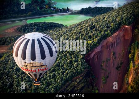 On balloon over Croscat volcano in Garrotxa Natural Park and mountains on the background in Garrotxa Olot Girona province Catalonia, Spain.  Vol de Co Stock Photo