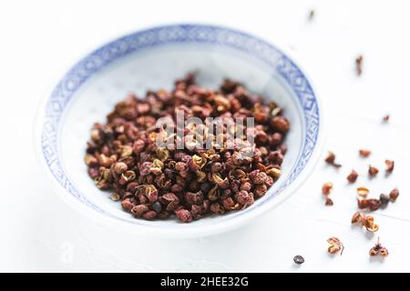 sichuan peppercorns in a bowl Stock Photo