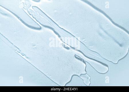 Liquid blue gel cosmetic smudge background. Water Stock Photo