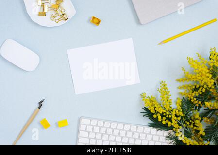 Blank paper, ink pen, yellow watercolor, mimosa flowers, keyboard. Copy the place for the wedding inscription or greeting card. Copy space for a blogg Stock Photo