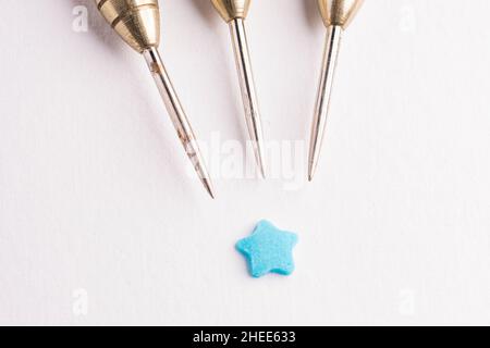 Three arrows dart tips on white with text space with star Stock Photo