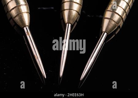 Three arrows dart tips on black with text space Stock Photo