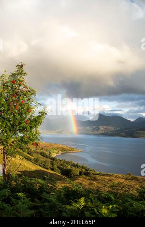 UK, Scotland, Wester Ross, Ross and Cromarty. Bealach na Gaoithe viewpoint on the road from Torridon to Lower Diabaig. A rainbow over Loch Torridon. Stock Photo