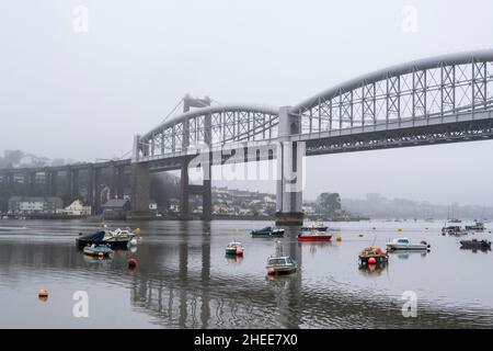 Plymouth, Devon. UK Weather: Boats on the River Tamar with Brunel's Albert Bridge dominating the background on a dull, wet and murky January day. Shown here the view from Plymouth looking out towards Saltash. Credit: Celia McMahon/Alamy Live News Stock Photo