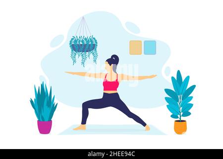 Young Woman Doing Yoga Indoors Stock Photo