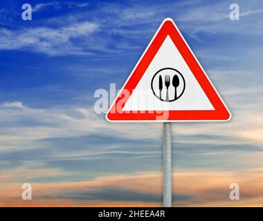 Triangle on rod road sign restaurant attention Stock Photo