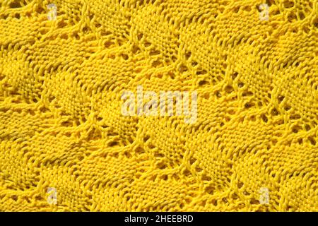 Yellow wool texture as fabric and textile background. Knitted wool fabric pattern. Abstract backdrop. Stock Photo