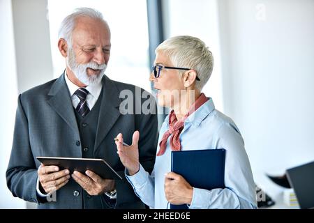 senior busniess people talking office communication Stock Photo
