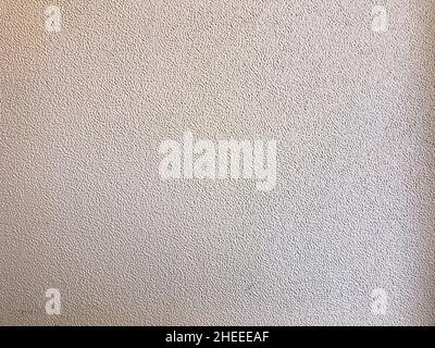 Light grey coloured abstract background, plastered surface of the city wall. Stock Photo