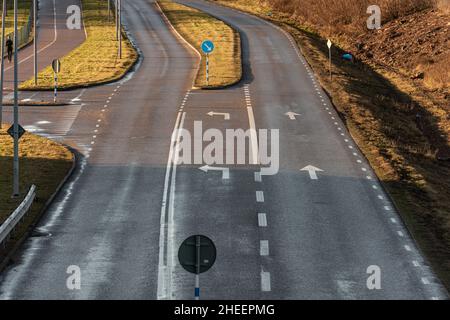Empty road junction with one plus two lanes. Stock Photo