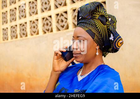 close up of a beautiful african woman making calls outdoor Stock Photo
