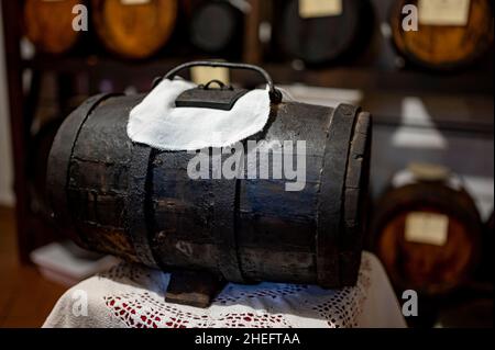 Traditional production and aging in wooden barrels of black Italian Balsamic wine IGP and DOC vinegar dressing in Modena, Italy Stock Photo