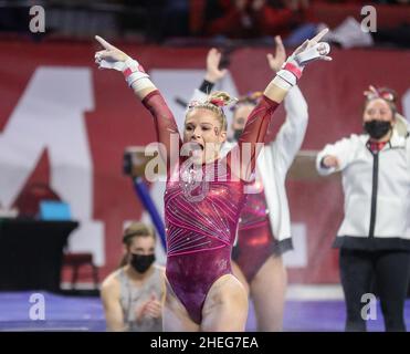 Norman, OK, USA. 9th Jan, 2022. Alabama's Ragan Smith is happy with her uneven bar routine during the NCAA gymnastics meet between the Alabama Crimson Tide and the Oklahoma Sooners at the Lloyd Noble Center in Norman, OK. Kyle Okita/CSM/Alamy Live News Stock Photo