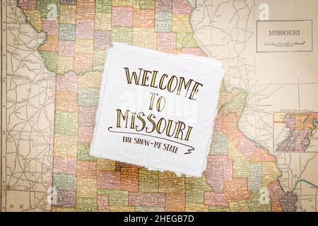 welcome to Missouri, the show-me state - handwriting on a square sheet of rough handmade paper floating over vintage defocused map of Missouri Stock Photo