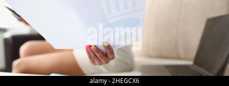 Lady analyze monthly report Stock Photo