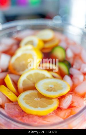 fruit punch in a drink dispenser at a party Stock Photo - Alamy