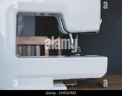 Sewing machine on a table in a sewing workshop Stock Photo