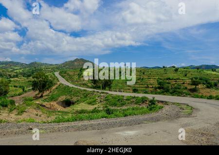 Panoramic View to the Green Trees and Mountains under Cloudy Blue Sky of the Omo River Valley, Ethiopia Stock Photo