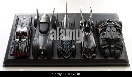 Set of five Batmobile from Batman movies on black display. Stock Photo