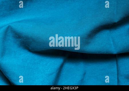Blue color twisted fabric cloth with shallow depth of field for background Stock Photo
