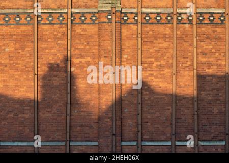 Rooftop shadows at sunrise on the derelict industrial mill 'Healings Flour Mill'. Tewkesbury, Cotswolds, Gloucestershire, England Stock Photo