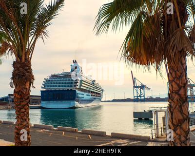 A large cruise ship anchored at a quay in Malaga harbour Stock Photo