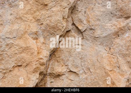 Natural stone background detail in warm tone. Texture Stock Photo
