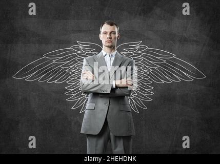 Businessman with wings Stock Photo