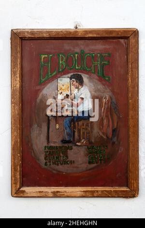Painted sign for leather work craft products 'El Boliche', Frigiliana, Axarquía, Andalusia, Spain Stock Photo