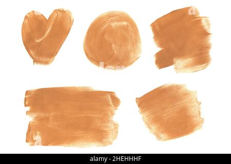Set of gold glittering acrylic brush strokes isolated on a white background. Decorative design elements. Stock Photo