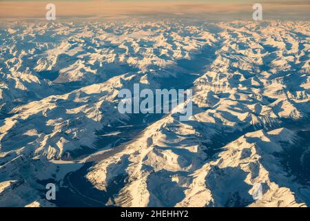 Winter aerial view over the snowy Canadian Rockies mountains, Alberta, Canada Stock Photo