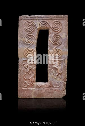 Mycenaean Garve stele with spiral relief and men hunting lions, 1600 - 1500 BC, Grave R Mycenae. Archaeological site Museum Mycenae. The top half of t Stock Photo