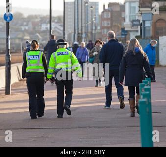 Portobello, Edinburgh, Scotland, UK. 11th Jan, 2022. Police presence on promenade the female officers had been asking members of the public for any detailed information regarding missing Alathea (Alice) Byrne if they were at the beach on the morning of 1st January 2022 when the young woman was last seen, taking thorough notes from anyone who was. Officers are also conducting house to house enquiries in the Portobello area. Credit: Archwhite/Alamy Live News Stock Photo