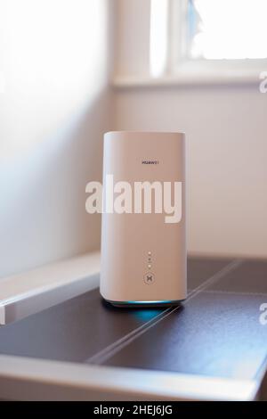 HUAWEI 5G Router and wi-fi enabled hub in a domestic setting with old ...