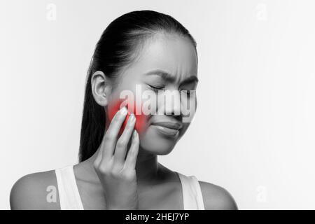 Japanese woman suffering from strong tooth pain, panorama Stock Photo