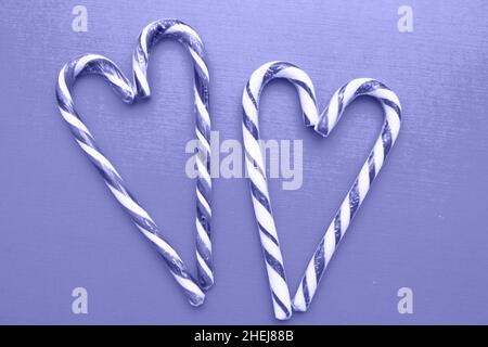 Two striped heart shaped lollipops on the background, Very Pure tone image. Valentines Day. copy space Stock Photo