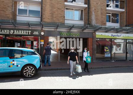 Egham, Surrey, UK. 20th May, 2020. Two women wear face masks as they leave the Waitrose Supermarket during the Coronavirus Covid-19 Pandemic lockdown. Credit: Maureen McLean/Alamy Stock Photo