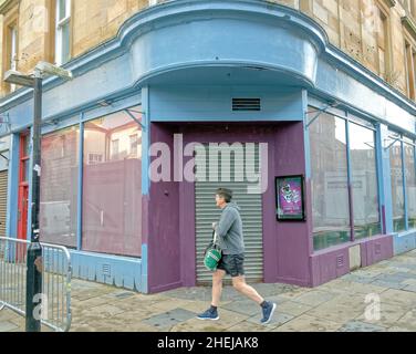 Glasgow, Scotland, UK. 11th Jan, 2022. New Batgirl film set latest as the road closures are in place with the shop fronts being built with art deco building and mercat cross with graffiti being used to communicate the dystopia. Credit: gerard ferry/Alamy Live News Stock Photo