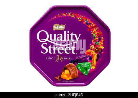 Tub of Nestle Quality Street chocolates sweets isolated on white background Stock Photo