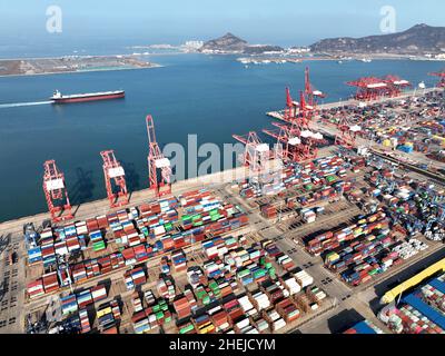 LIANYUNGANG, CHINA - JANUARY 11, 2022 - A view of cargo loading and unloading at the Port of Lianyungang, Lianyungang City, Jiangsu Province, China, J Stock Photo